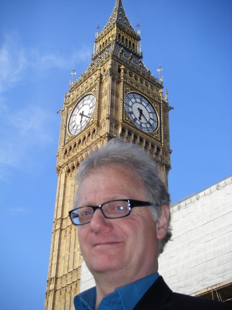 Cartoonist Simon Ellinas under Big Ben in Westminster London